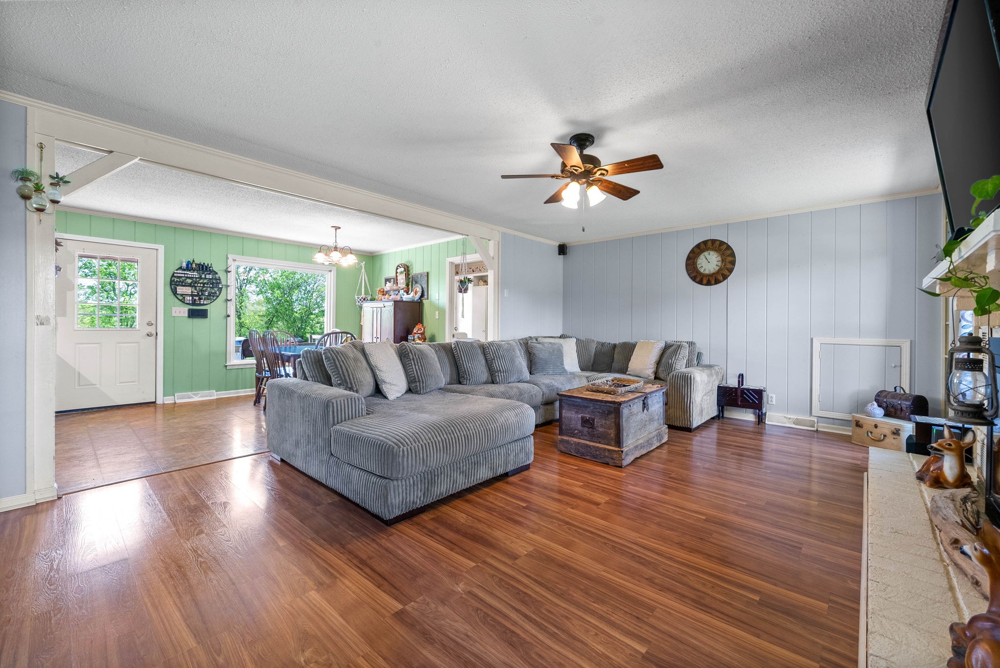 558 Bumpus Road Cunningham, TN 37052 - Photo 9 of 64 a living room with couches and a flat screen tv with kitchen view