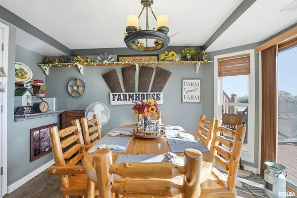 a bedroom with a bed and a dresser with mirror