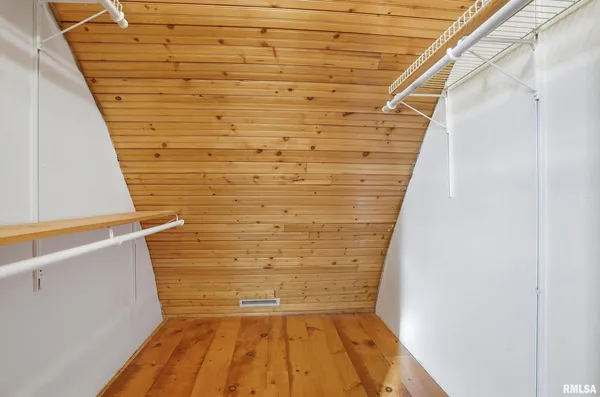 a view of a room with stairs and a wooden floor