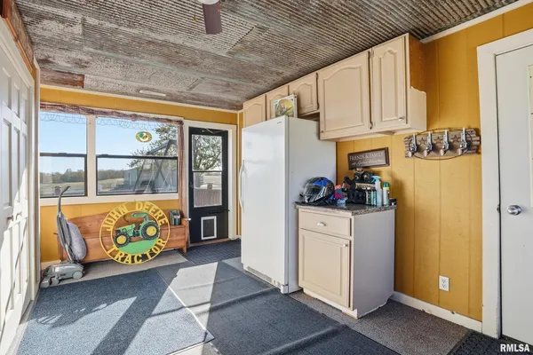 a kitchen with stainless steel appliances granite countertop a refrigerator and a stove