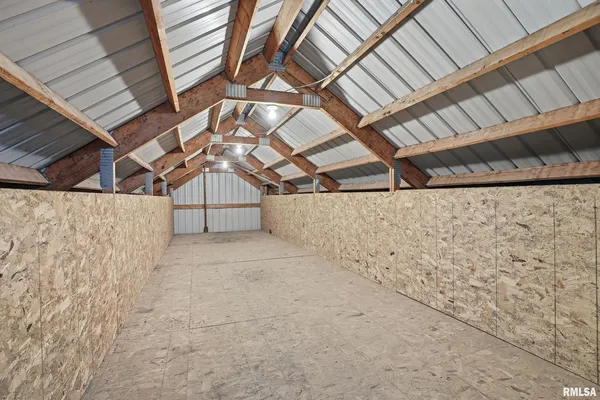 a balcony with wooden floor and fence