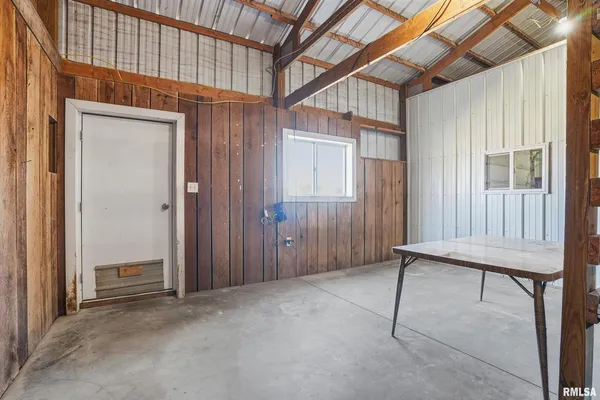 a view of a house with a backyard porch and sitting area