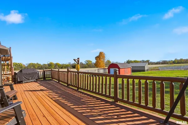 a view of a chairs and table in a backyard