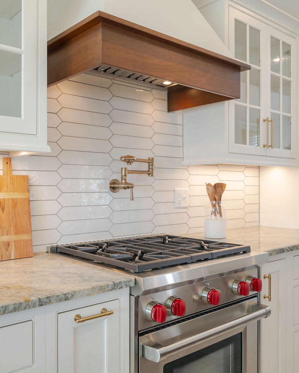 39 Bay Shore Road Hyannis, MA 02601 - Photo 12 of 63 a kitchen with a stove and a white cabinets