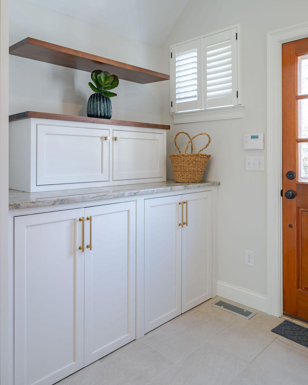 39 Bay Shore Road Hyannis, MA 02601 - Photo 14 of 63 a kitchen with white cabinets and potted plant