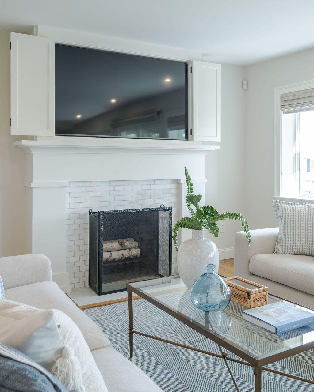 39 Bay Shore Road Hyannis, MA 02601 - Photo 21 of 63 a living room with furniture and a fireplace