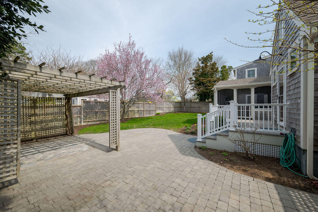 39 Bay Shore Road Hyannis, MA 02601 - Photo 48 of 63 a view of a house with backyard and a tree