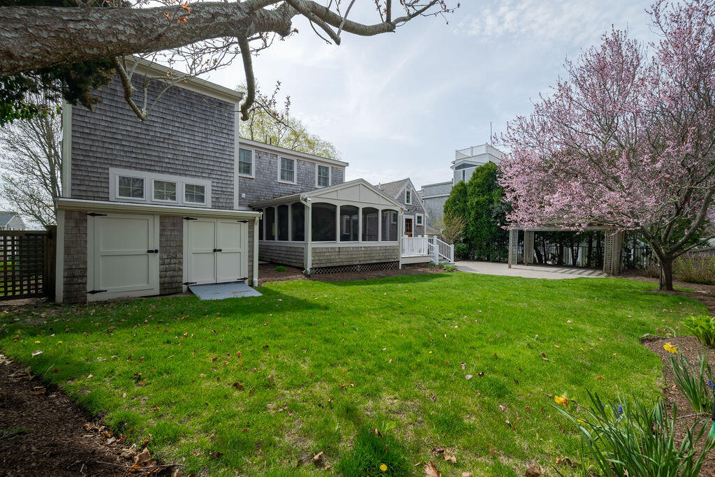 39 Bay Shore Road Hyannis, MA 02601 - Photo 49 of 63 a view of a house with a backyard and a tree