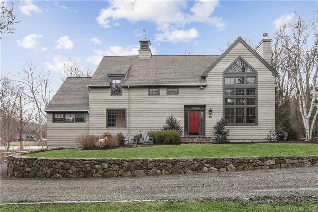 22 Pocahontas Road Redding, CT 06896 - Photo 1 of 1 a front view of a house with a garden