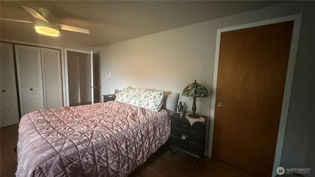 a living room with furniture a couch and wooden floor