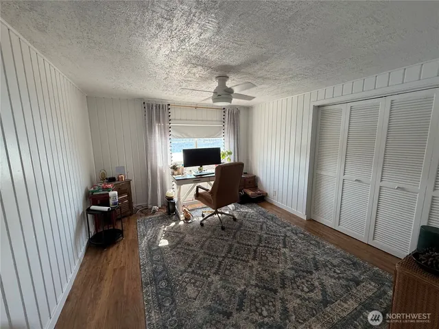 a bedroom with a bed and a closet