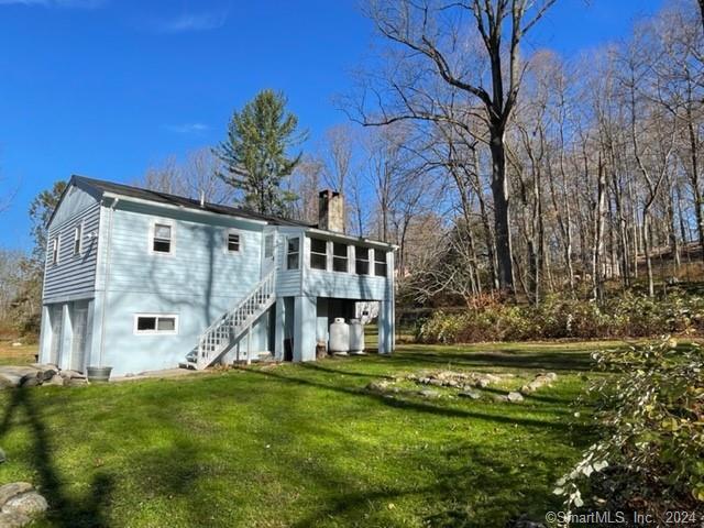 86 Pocahontas Road Redding, CT 06896 - Photo 14 of 23 a view of a house with a yard