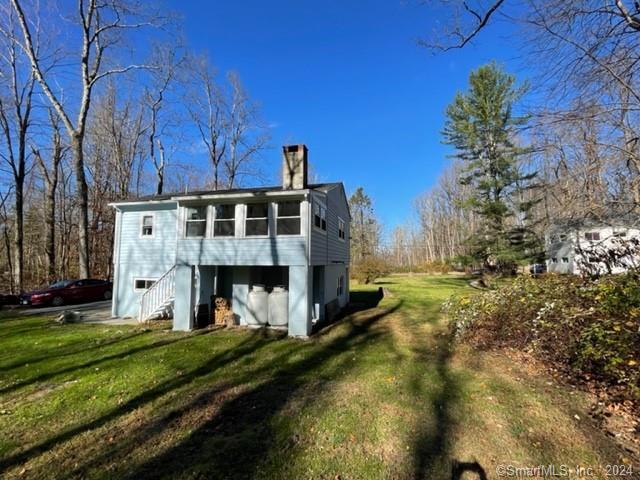 86 Pocahontas Road Redding, CT 06896 - Photo 17 of 23 a view of a house with a big yard and large trees
