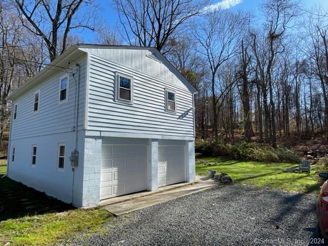 86 Pocahontas Road Redding, CT 06896 - Photo 19 of 23 a view of a house with backyard and trees
