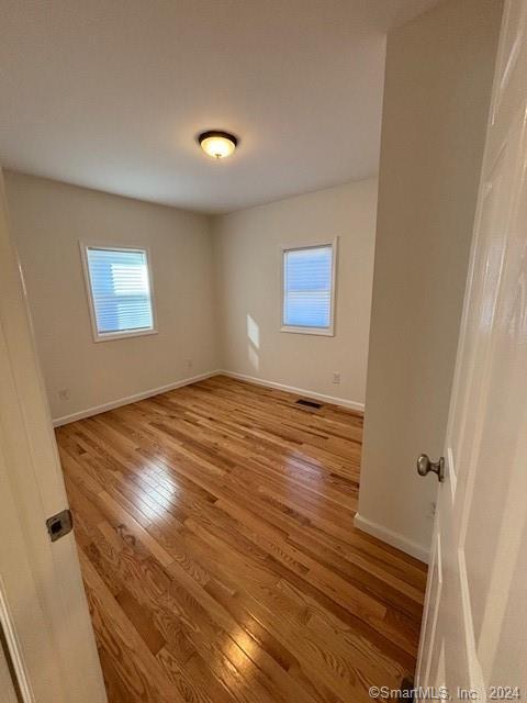 86 Pocahontas Road Redding, CT 06896 - Photo 22 of 23 a view of empty room with wooden floor