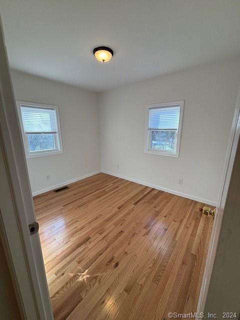 86 Pocahontas Road Redding, CT 06896 - Photo 8 of 23 a view of empty room and wooden floor
