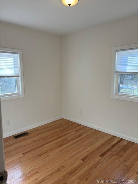 86 Pocahontas Road Redding, CT 06896 - Photo 9 of 23 a view of empty room with wooden floor and fan