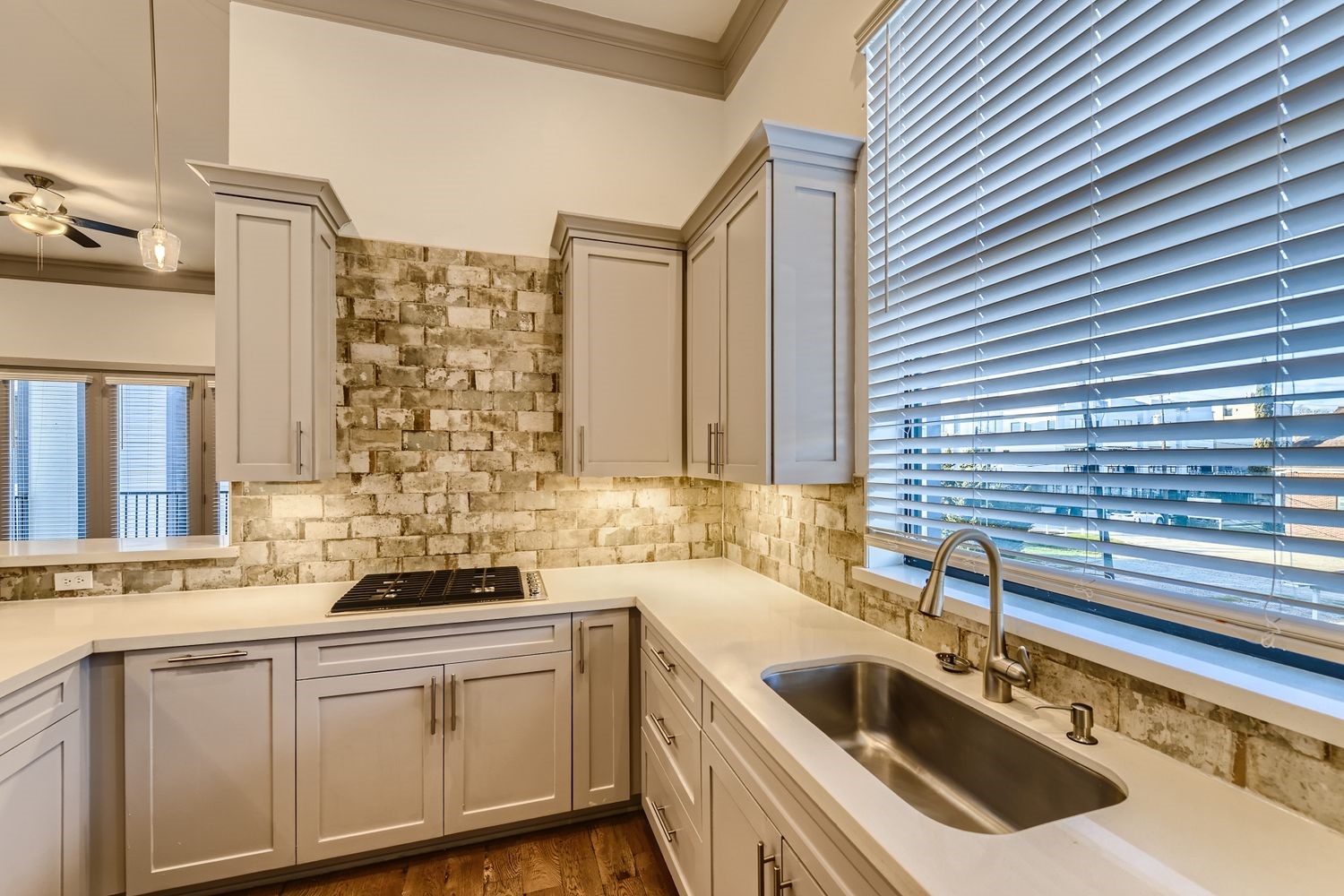 2208 Arabelle Street Houston, TX 77007 - Photo 4 of 26 a kitchen with a sink cabinets and window