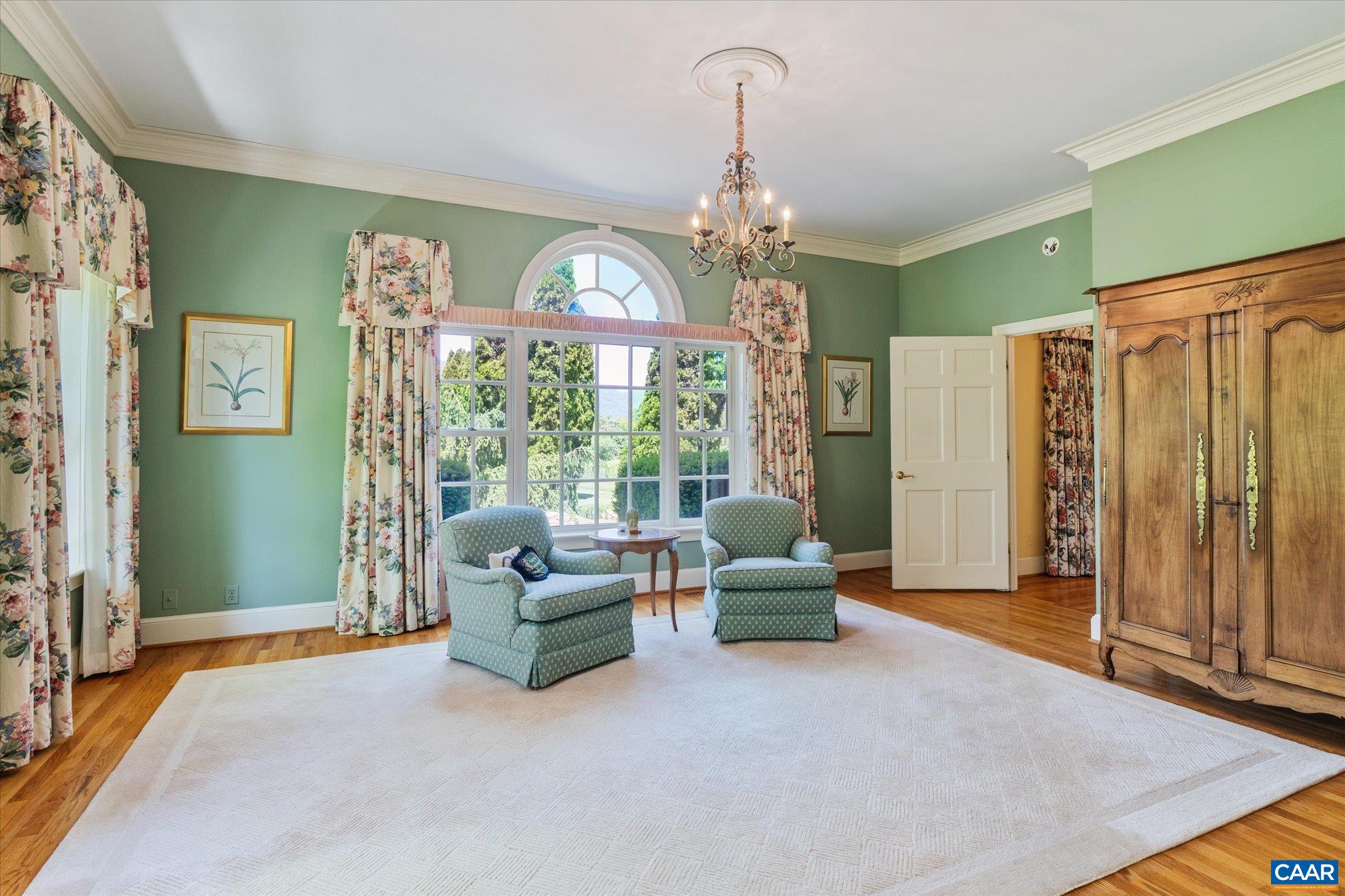 5190 Sugar Ridge Road Crozet, VA 22932 - Photo 33 of 69 a living room with furniture chandelier and a large window