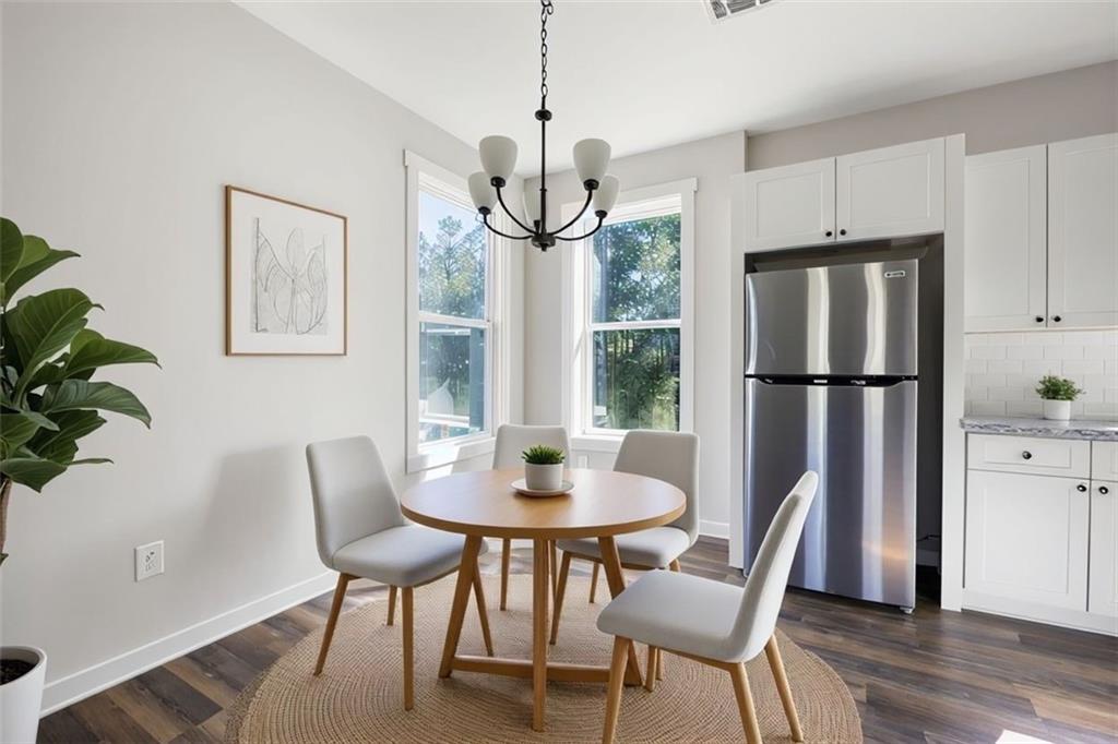 205 Pinecrest Road Cedartown, GA 30125 - Photo 12 of 27 a dining room with furniture a chandelier and wooden floor