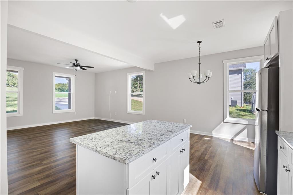 205 Pinecrest Road Cedartown, GA 30125 - Photo 16 of 27 a view of kitchen and hall with wooden floor