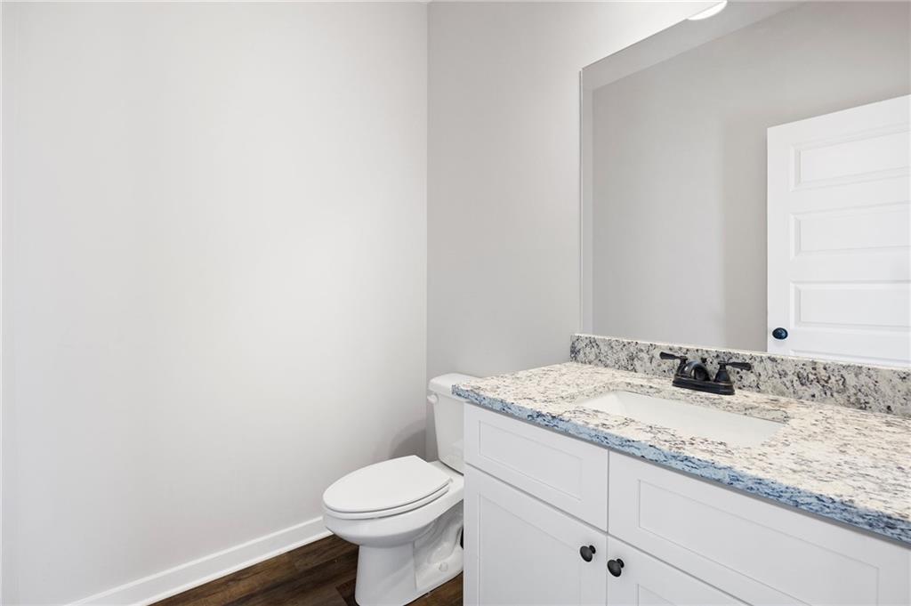 205 Pinecrest Road Cedartown, GA 30125 - Photo 17 of 27 a bathroom with a granite countertop toilet and sink