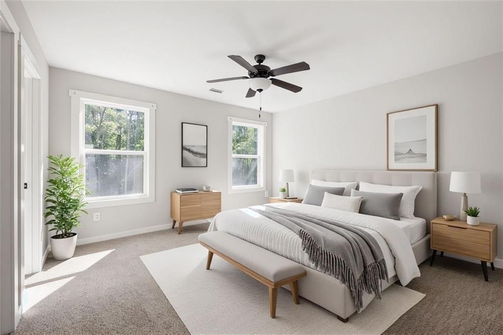 205 Pinecrest Road Cedartown, GA 30125 - Photo 18 of 27 a bedroom with a large bed and windows