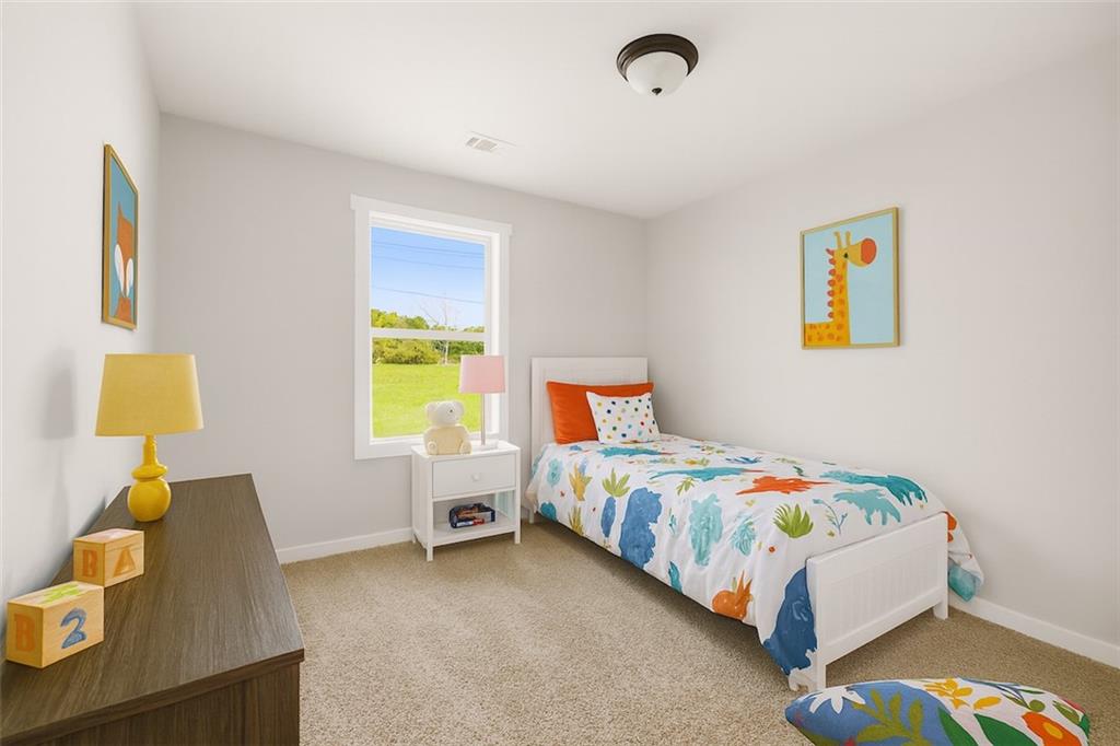 205 Pinecrest Road Cedartown, GA 30125 - Photo 22 of 27 a bedroom with a bed and a window