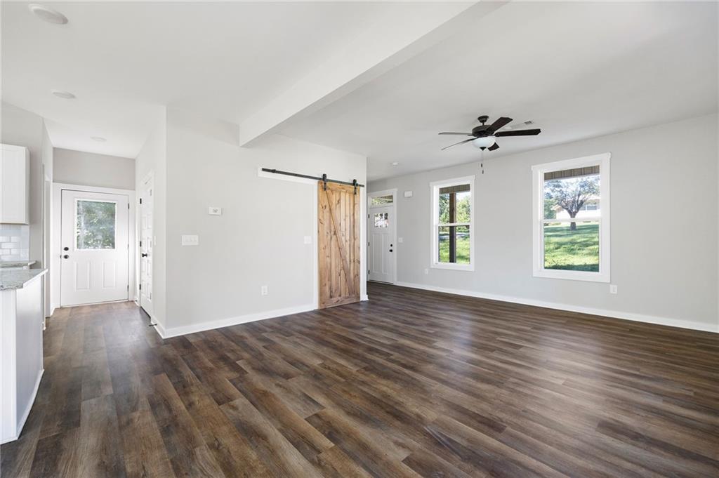 205 Pinecrest Road Cedartown, GA 30125 - Photo 10 of 27 a view of an empty room with wooden floor and a window