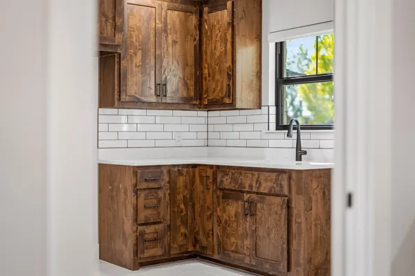 a kitchen with a sink and a window