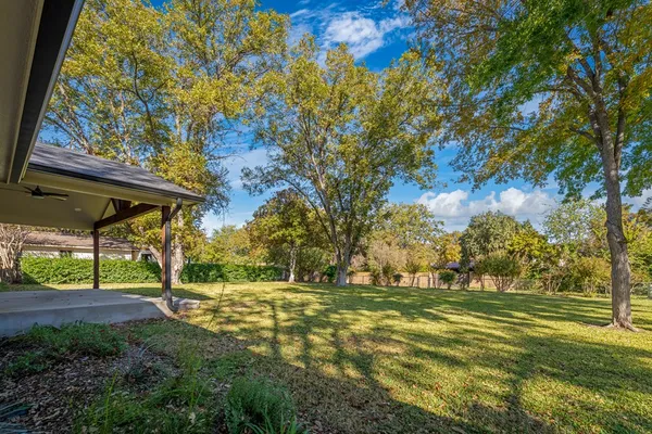 a view of outdoor space with deck and tree