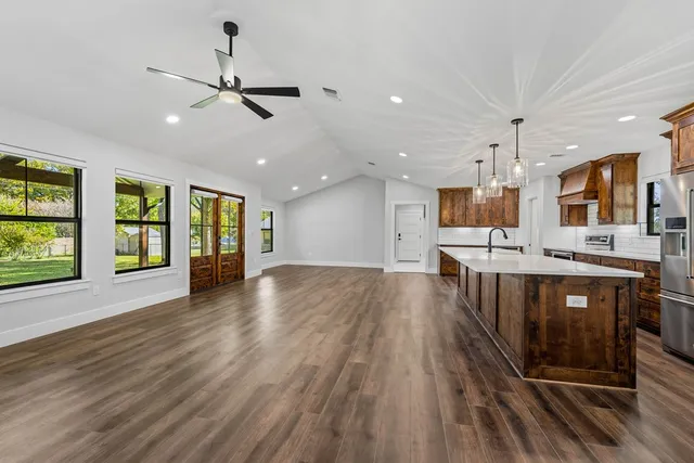 a view of a kitchen with a sink and microwave