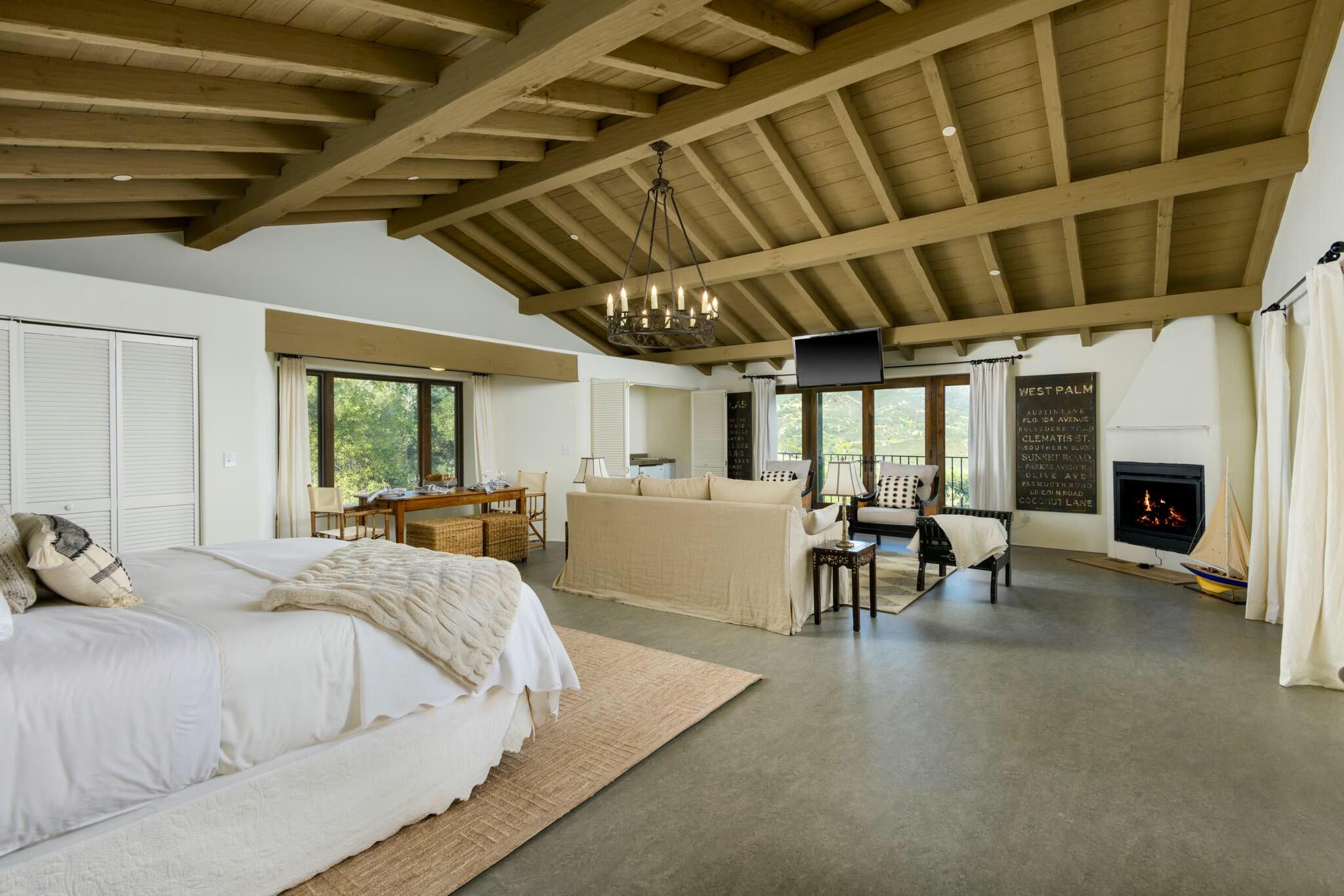 272 El Cielito Road Santa Barbara, CA 93103 - Photo 17 of 24 a bedroom with furniture and a fireplace