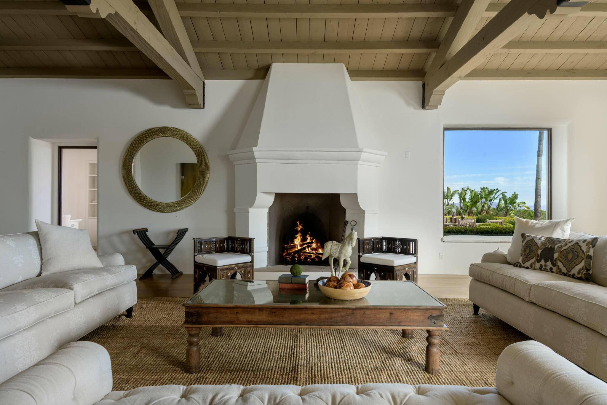 272 El Cielito Road Santa Barbara, CA 93103 - Photo 8 of 24 a living room with furniture and a fireplace