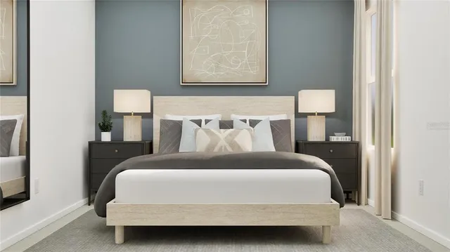 a bedroom with a bed and a night stand