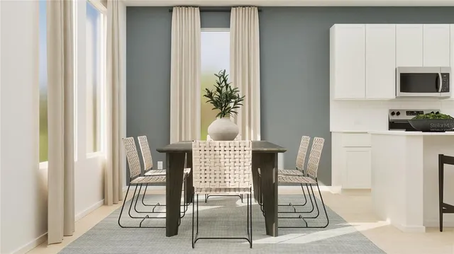 a view of a dining room with furniture