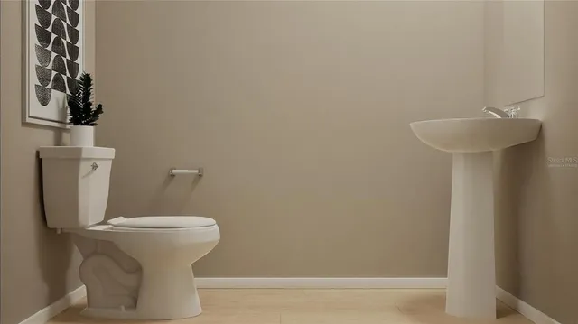 a bathroom with a sink and toilet