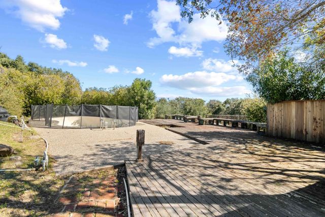 a view of a backyard of the house
