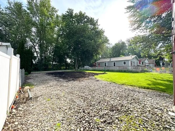a view of a swimming pool with a yard