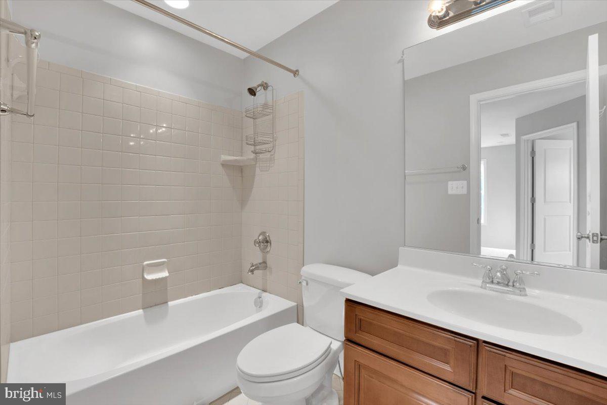 41625 Broxbourne Terrace Aldie, VA 20105 - Photo 14 of 43 a bathroom with a sink a toilet and shower