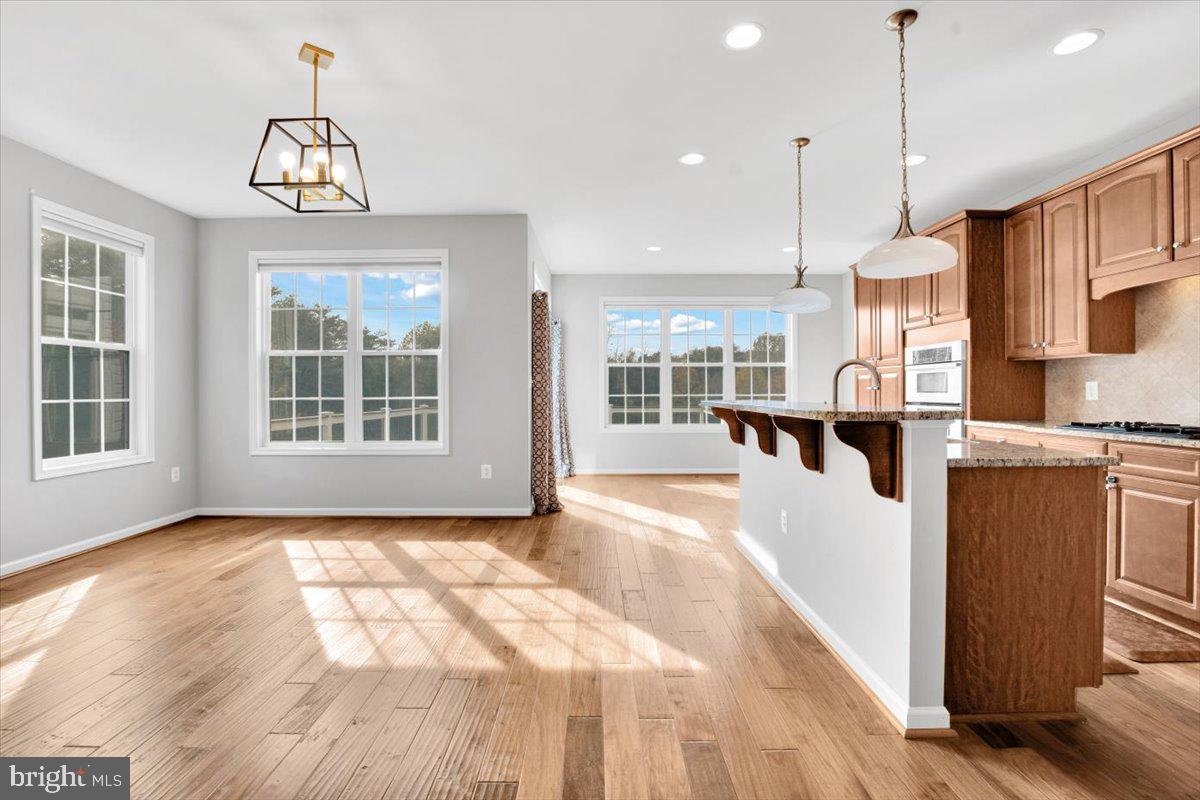 41625 Broxbourne Terrace Aldie, VA 20105 - Photo 22 of 43 a view of a kitchen with granite countertop a window