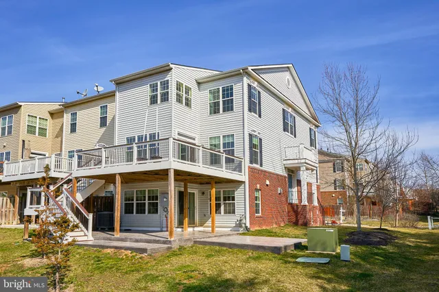 a front view of a building with a swimming pool