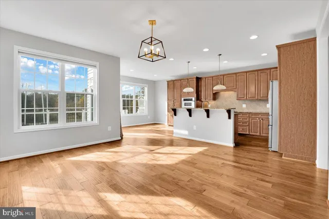 a view of kitchen with furniture and wooden floor