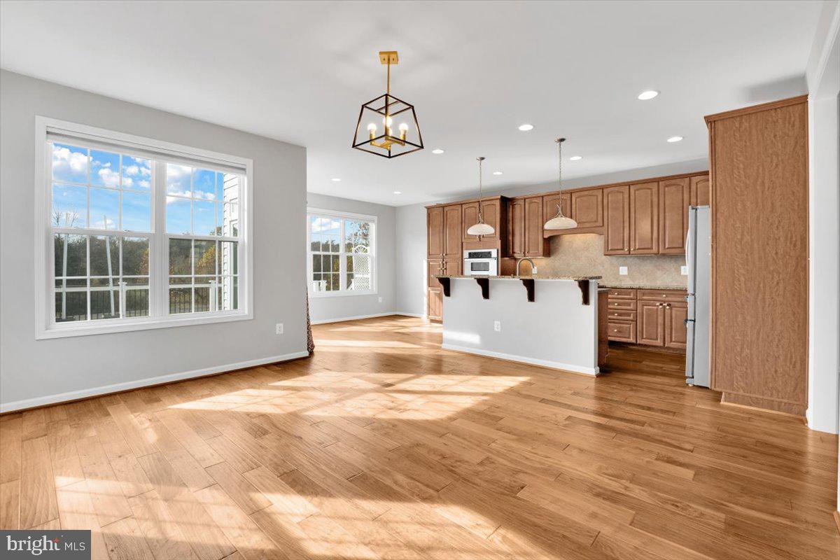 41625 Broxbourne Terrace Aldie, VA 20105 - Photo 31 of 43 a view of kitchen with furniture and wooden floor