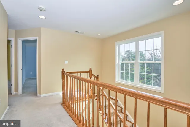a view of a hallway with windows