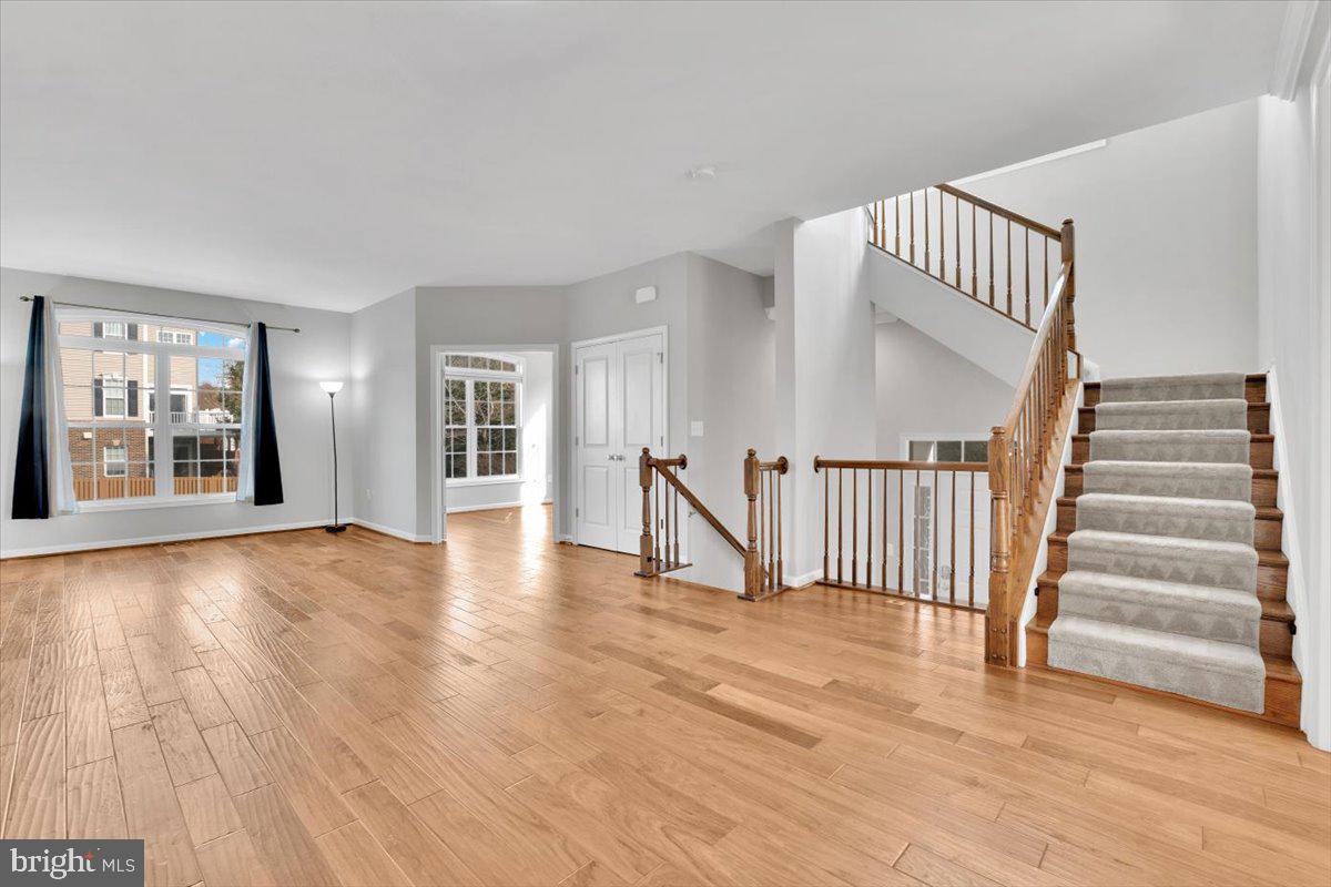 41625 Broxbourne Terrace Aldie, VA 20105 - Photo 33 of 43 a view of an empty room with wooden floor and a window
