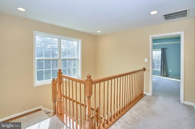 a view of a hallway with a window