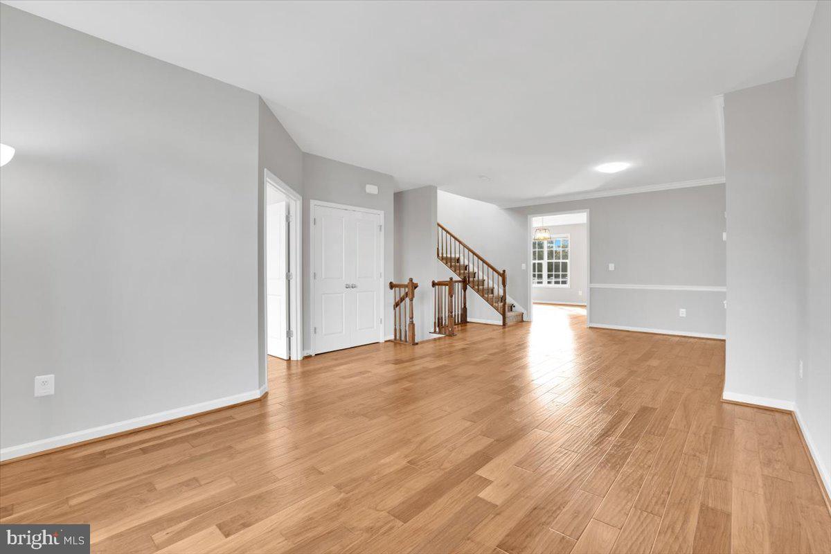 41625 Broxbourne Terrace Aldie, VA 20105 - Photo 34 of 43 a view of a hallway with wooden floor
