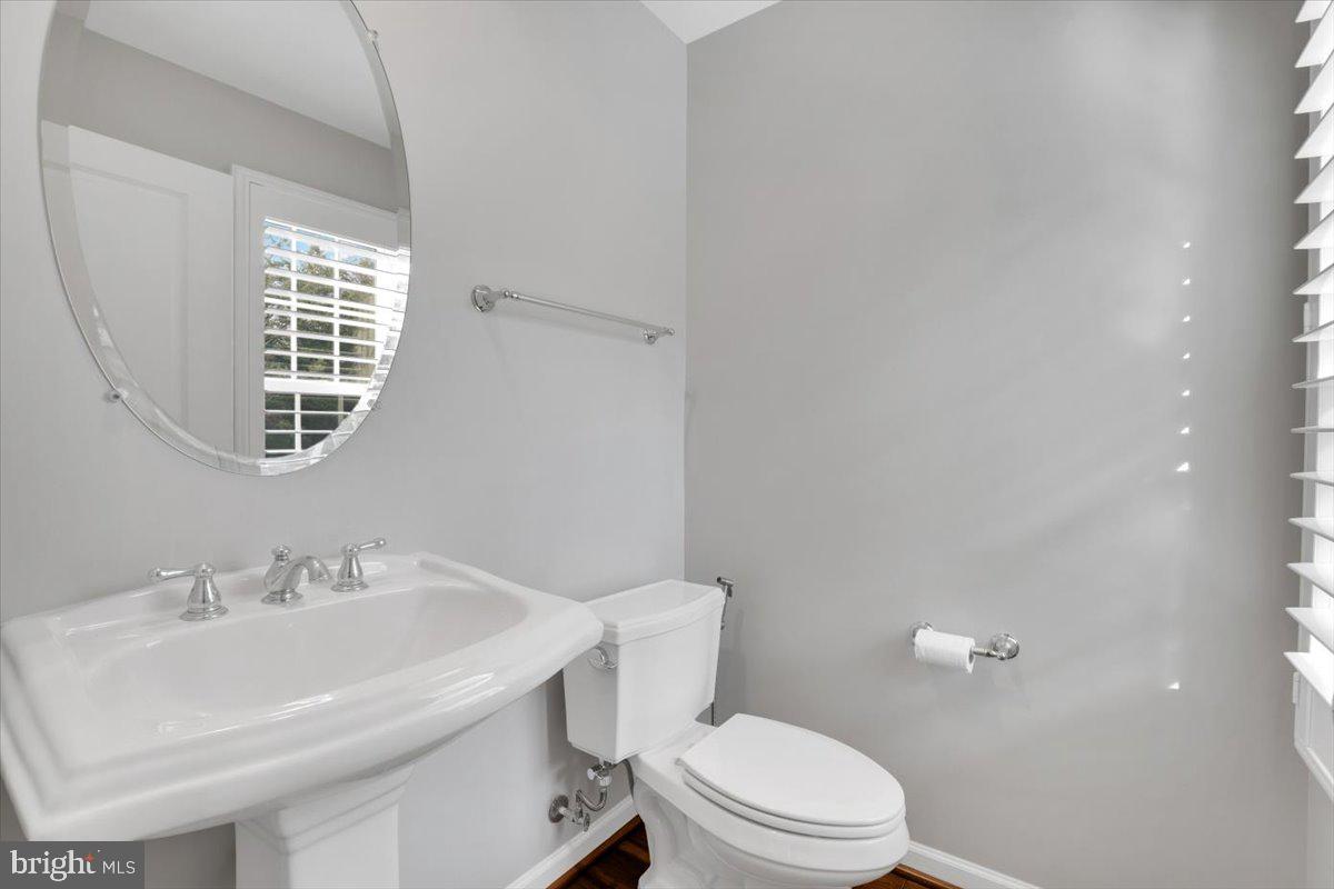 41625 Broxbourne Terrace Aldie, VA 20105 - Photo 37 of 43 a bathroom with a sink a toilet and a mirror