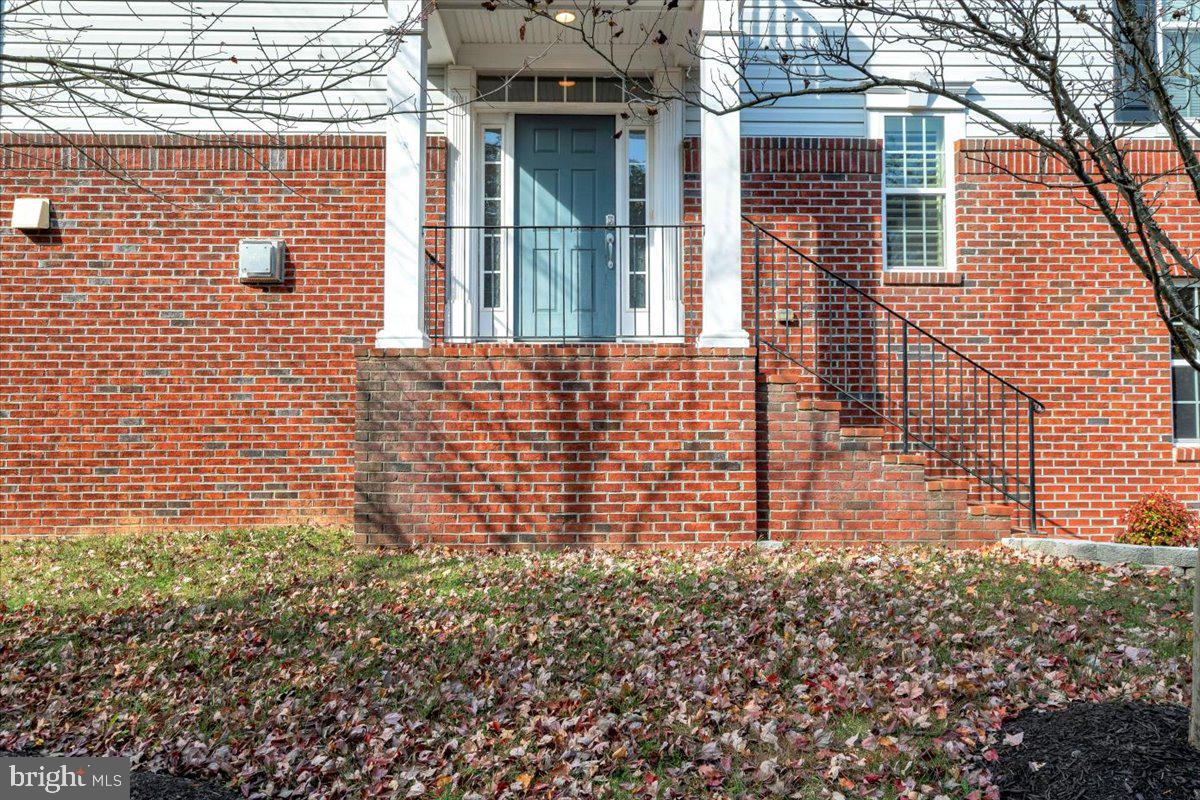 41625 Broxbourne Terrace Aldie, VA 20105 - Photo 42 of 43 a brick building with a view of the house